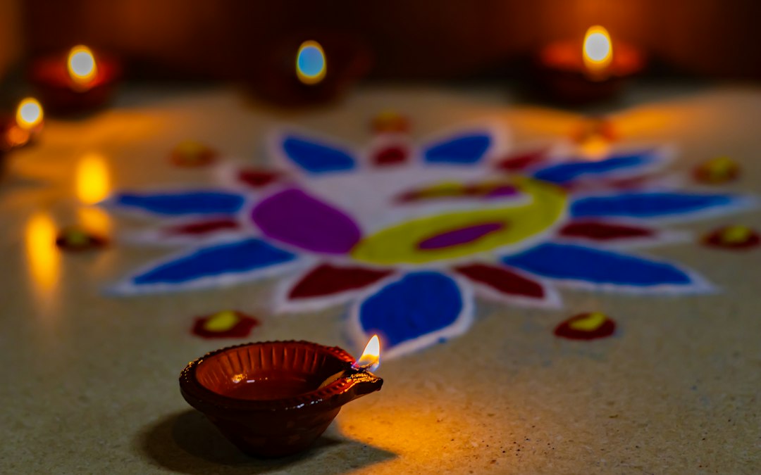 Diwali celebration with glowing diyas, rangoli and traditional Indian decorations