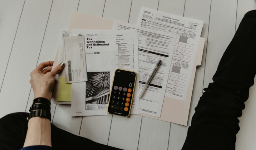Financial documents and calculator representing IPO issue-size regulations