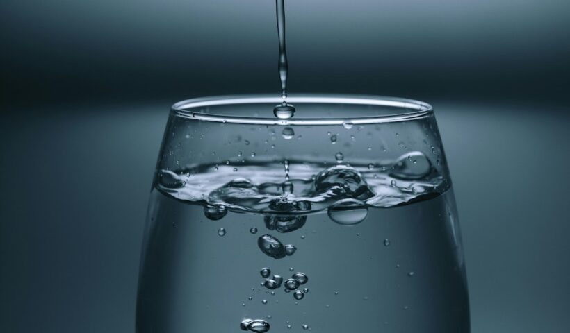 Clear drinking water in a glass, representing hydration