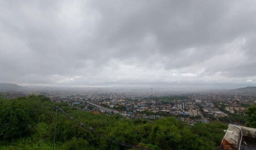 Jaipur city skyline under cloudy monsoon-like skies