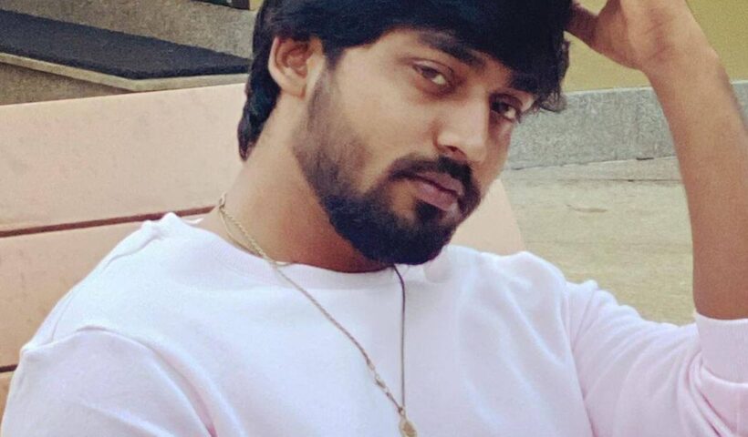Television actor Mukesh Gowda in a white sweatshirt in a casual portrait