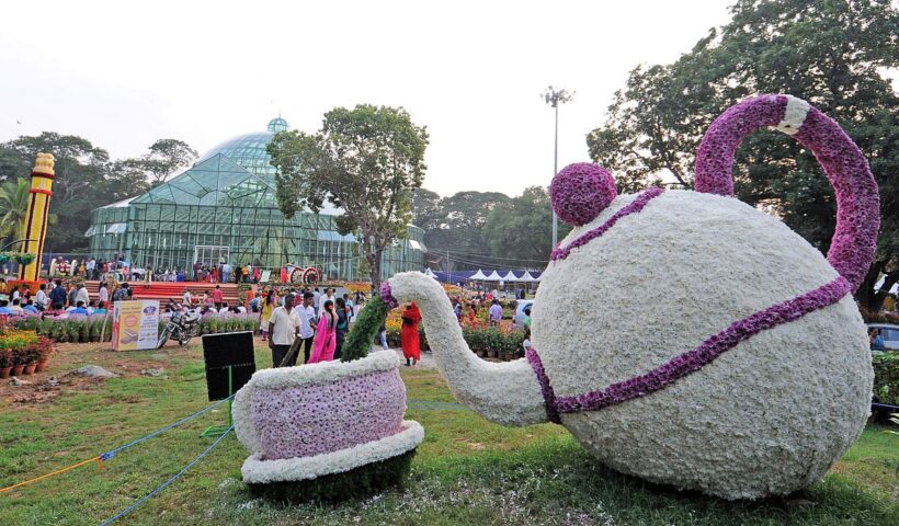 Floral sculpture and visitors at Mysuru Dasara