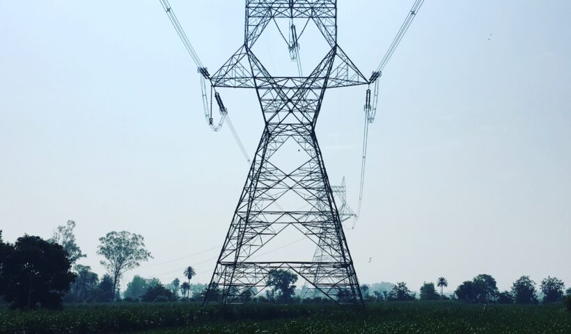 Electricity transmission tower in an Indian field
