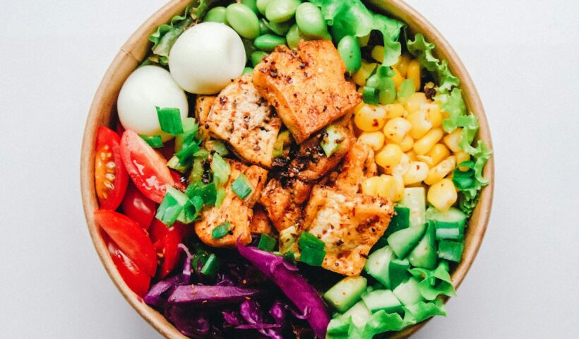 A bowl of colourful fresh food representing balanced nutrition